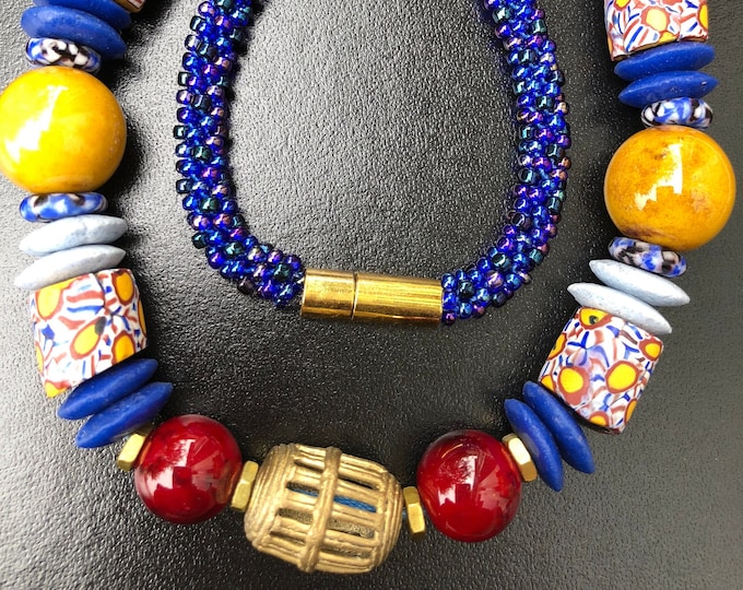 Kente TradeWinds Necklace, blue yellow burgundy Kumihimo/ beaded braids/ Krobo beads/ antique Millefiore trade beads/ Japanese Toho beads