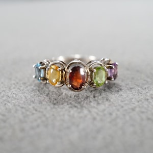 May include: A rustic wooden sign with the text "Welcome to our home" in white lettering. The sign features a distressed finish and a simple, inviting design, perfect for front door decor.