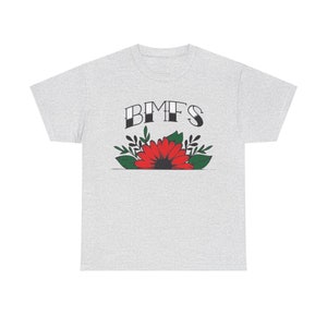 May include: A grey t-shirt with the text "BMFS" in black lettering and a red flower with green leaves.