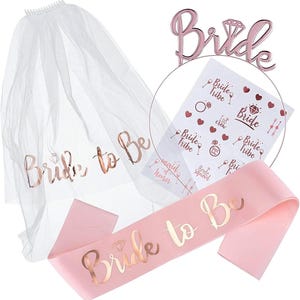 May include: A bridal set featuring a white veil with "Bride to Be" text, a pink sash with the same text, and a rose gold "Bride" headpiece. Includes stickers with bridal party themed graphics.