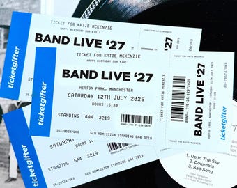 May include: Two white concert tickets with blue side panels featuring the text TICKETGIFTER. The tickets are printed with BAND LIVE '27, TICKET FOR KATIE MCKENZIE, HAPPY BIRTHDAY OUR KID!!, HEATON PARK, MANCHESTER, SATURDAY 12TH JULY 2025, DOORS 15:30.