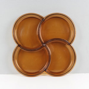 May include: A set of three ceramic nesting bowls in graduating sizes. The bowls are white with a speckled, textured finish and a slightly flared rim. The largest bowl is approximately 8 inches in diameter.