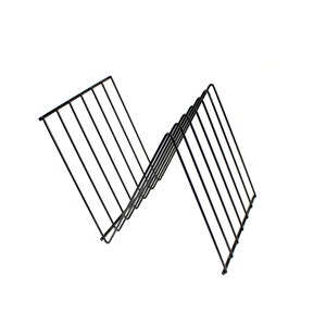 May include: A black metal dish rack with a zig-zag design. The rack is made of thin, vertical wires connected by horizontal bars. The rack is designed to hold plates and other dishes.