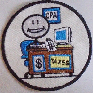 May include: A white embroidered patch featuring a cartoon stick figure accountant sitting at a desk with a computer, a sign that reads "CPA", and a sign that reads "Taxes".