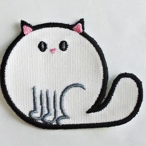 May include: White embroidered iron-on patch of a cartoon cat with black outlines and pink ears. The cat is sitting with its tail curled around its body.