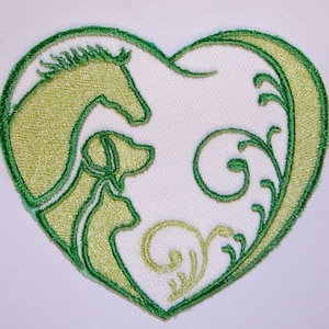 May include: Green embroidered heart-shaped patch featuring a horse and dog silhouette, and a floral design.