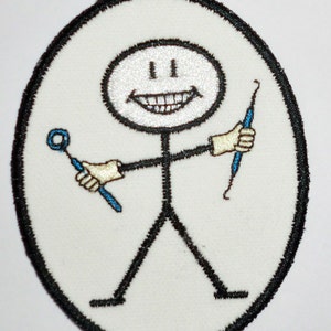 May include: White oval patch with a black outline. A stick figure with a smiling face holds two blue dental tools. The stick figure is wearing white gloves.