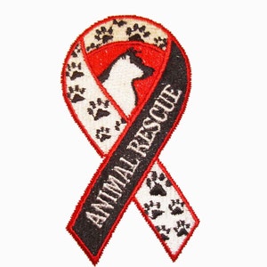 May include: Embroidered ribbon patch with the words "ANIMAL RESCUE" in white on a black ribbon. The ribbon is red with white paw prints and a white dog silhouette.