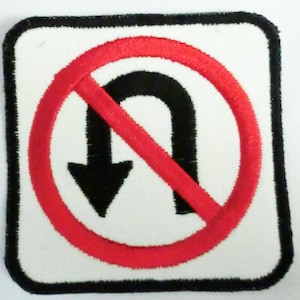 May include: A white square-shaped patch with a black border. Inside the square is a red circle with a diagonal red line through it. Inside the circle is a black U-turn arrow.