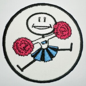 May include: A white embroidered patch with a stick figure of a cheerleader holding two red pom-poms. The cheerleader is wearing a blue and white skirt and a white shirt with a blue emblem.