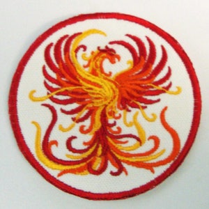 May include: Red and yellow embroidered phoenix bird patch with a white background and a red circular border.
