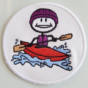 May include: A white embroidered patch with a stick figure wearing a purple helmet and a life vest paddling a red kayak in blue water.