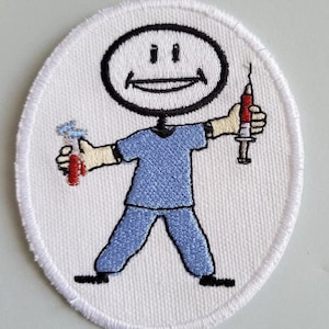May include: White embroidered patch featuring a stick figure wearing a blue scrub top and holding a syringe and a toothbrush. The stick figure has a smiling face.