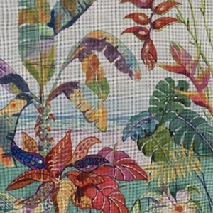 May include: A colorful fabric with a tropical print featuring green, red, yellow, and blue leaves and flowers.