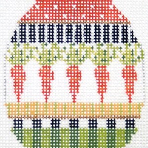 May include: A red, white, green, and blue needlepoint Easter egg ornament with a design of carrots and a striped pattern.