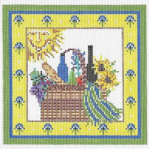 May include: A square needlepoint canvas featuring a brown woven basket filled with a blue bottle, a baguette, sunflowers, and grapes. The design is framed by a yellow border with blue floral motifs and a green outer edge, with a sun in the corner.