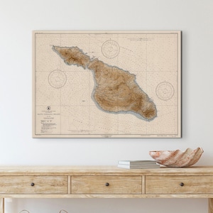 Vintage Nautical chart of Santa Catalina Island hung on a wall above a wooden console table.