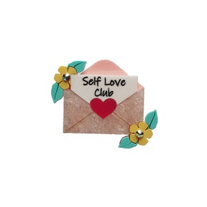 Broche de carta de amor propio