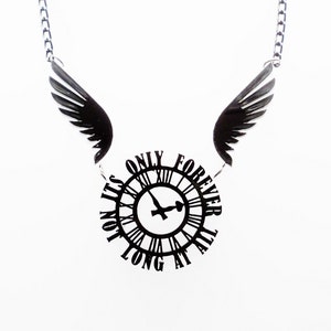 May include: A silver chain necklace with a black clock pendant that reads "It's not long at all, only forever". The clock has a black bird design inside and is attached to two black wings.