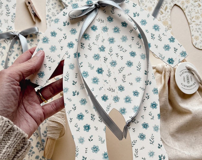 Blue Baby Shower Decoration, Elegant Blue Floral Baby Clothes Decor with Ribbon Bows, 5 - 8 1/4"W x 9 3/16"H Pajamas, Adjustable Length