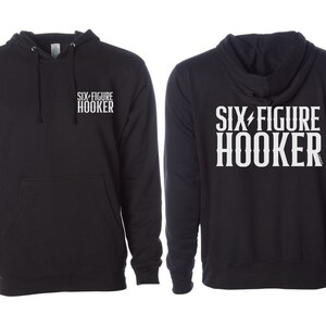 May include: Black hooded sweatshirt with the text "SIX FIGURE HOOKER" in white on the back and the same text in smaller font on the front.