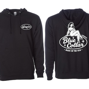 May include: Black hoodie with a front pocket and drawstring hood. The front features a white oval logo with the text "Lynngrove". The back displays a white graphic with a seated woman and the words "Blue Collar - Made in the USA".