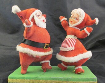 Flocked Plastic Mr and Mrs Santa Claus Dancing on a Green Base 1950s