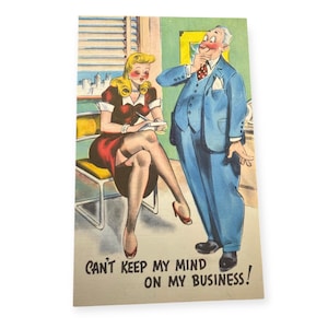 May include: A vintage postcard with a cartoon illustration of a man and a woman in an office setting. The man is wearing a blue suit and has a surprised expression on his face. The woman is wearing a red dress and is sitting in a chair. The text on the postcard reads "Can't keep my mind on my business!"
