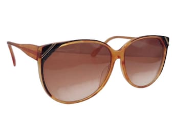 Gafas de sol vintage extragrandes en color marrón. Forma ovalada ligeramente ojo de gato, de Sebastiano, modelo 600.