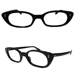 May include: Black cat-eye glasses with a gold accent on the side. The glasses have a classic retro style.