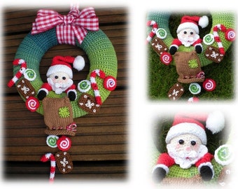 May include: A green crocheted wreath with a red and white gingham bow. A crocheted Santa Claus figure is hanging from the wreath, holding a brown sack. The wreath is decorated with candy canes, gingerbread cookies, and candy swirls.