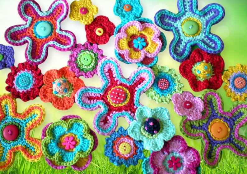May include: A collection of colorful crocheted flowers in various shapes and sizes. The flowers are made with different colored yarns and have a variety of button embellishments in the center.