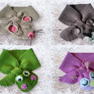 Può includere: Quattro sciarpe di lana con facce di animali. Le sciarpe sono di colore marrone, verde, rosa e grigio. Gli animali sono un topo, un orso, una rana e un gufo.