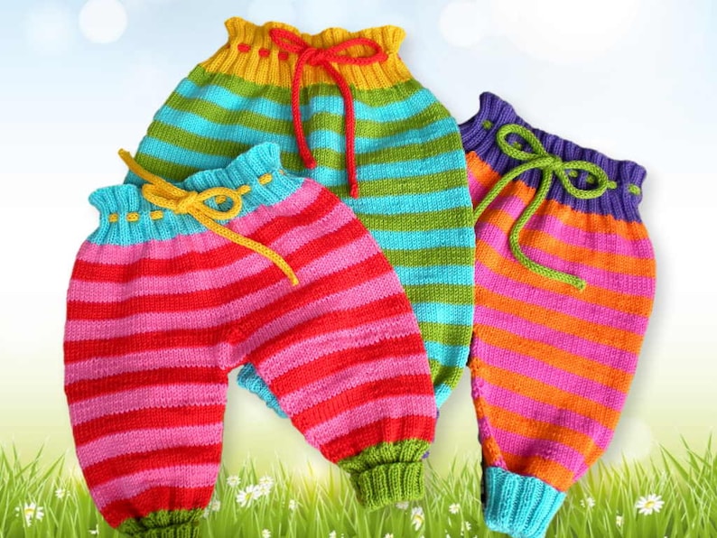 May include: Three pairs of striped knit baby pants in pink, orange, and green with yellow, purple, and green drawstrings.