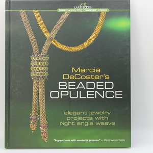 May include: Book cover for "Beaded Opulence" by Marcia DeCoster. The cover features a gold beaded necklace with a green and purple beaded pendant. The title "Beaded Opulence" is in large, bold letters. The subtitle is "Elegant jewelry projects with right angle weave".