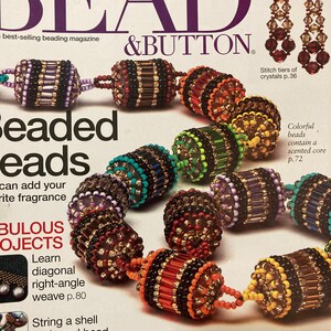 May include: A magazine cover for Bead & Button magazine featuring a colourful beaded necklace with a variety of beads and a close-up of a beaded bracelet. The magazine cover also features the text "Beaded Beads" and "Don't Miss".