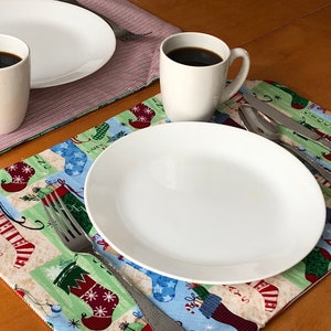 Christmas Placemats! Set of Four Reversible December Holiday Placemats featuring Stockings and Stripes- Red, Green, Blue, Cream