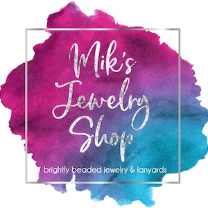 May include: A logo featuring a vibrant watercolor splash in shades of magenta, purple, and teal. Centered is a silver square frame enclosing the white cursive text Mik's Jewelry Shop and the smaller white text brightly beaded jewelry & lanyards.