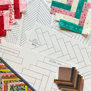 May include: A close-up of a quilting project with fabric scraps cut into strips and arranged in a pattern. The fabric scraps are in various colors, including red, pink, green, and brown. The image also includes a printed pattern sheet with instructions for the quilting project. The pattern sheet includes the text "Honey Muffin" and "Foundation Piecing Template Large".