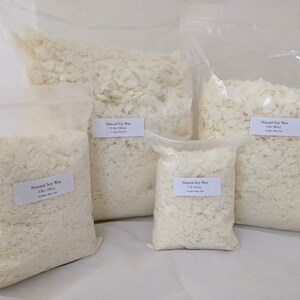 May include: Five bags of white soy wax flakes in various sizes. The bags are labeled with "Natural Soy Wax" and the weight of the wax in pounds and ounces.