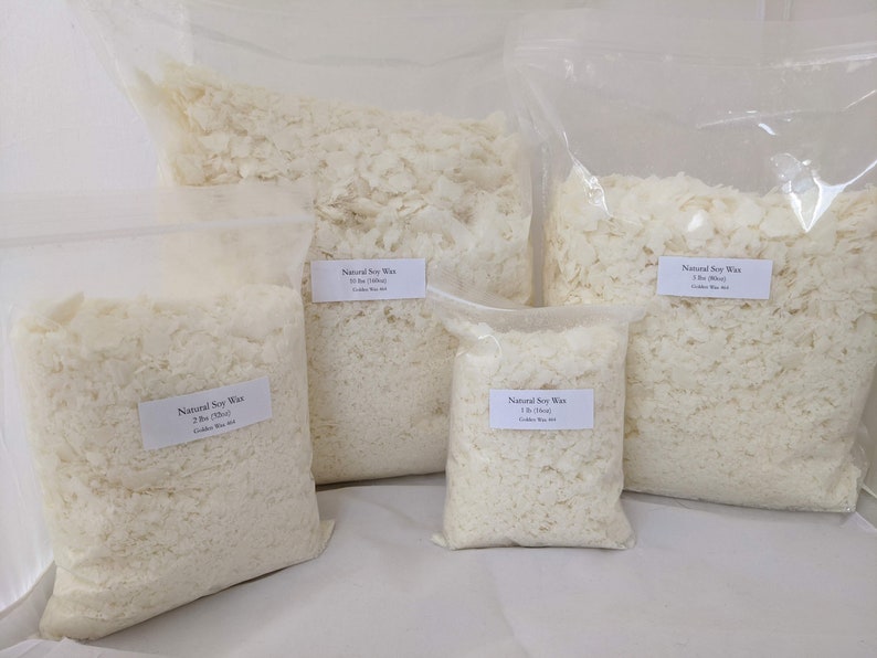 May include: Five bags of white soy wax flakes in various sizes. The bags are labeled with "Natural Soy Wax" and the weight of the wax in pounds and ounces.
