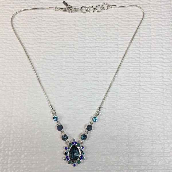 Silver Toned Necklace With Blue stone Teardrop Pendant Surrounded By Blue And Green stones Marked Nine West Used 15” With 2” Extender