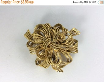 large gold brooch