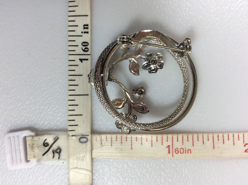 Vintage Silver Toned Pin Brooch Circle With Flowers And Blue Rhinestones Used