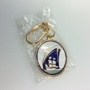 Vintage Keychain Gold Toned Oval With Cruise And Tall Ships White Blue Green Enamel New Old Stock