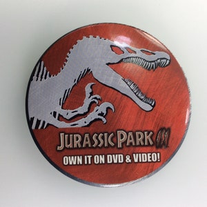 Vintage Pin Back Button Universal Studios Jurassic Park III Own It On Video 2001 Used