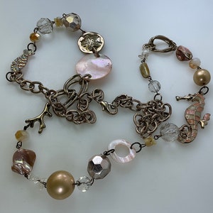 Vintage 34” Necklace Gold Toned Chain With Seahorse Sand Dollar Fish Shell Pink Clear Beads AB Rhinestones Gray Pink Enamel Used