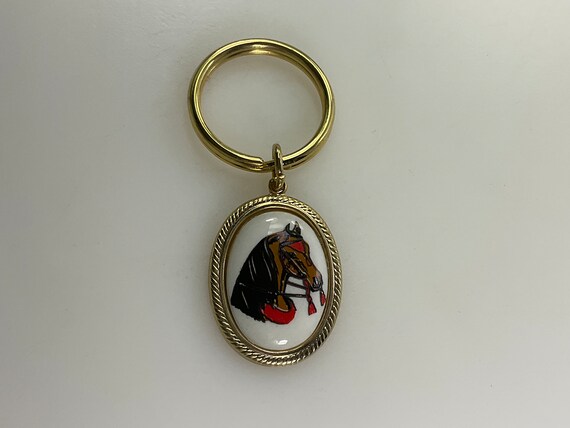 Vintage Keychain Gold Toned Oval With Black Red B… - image 1