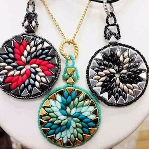 May include: Three beaded necklaces with circular pendants. The pendants are made of black, white, and silver beads, and red, white, and silver beads, and turquoise, green, and gold beads.