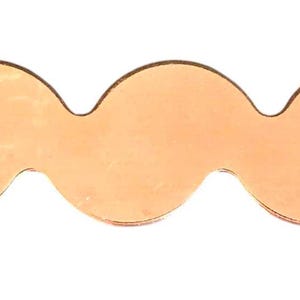 May include: A wavy, copper-colored metal decorative element with a series of rounded curves. The design has a mustache-like shape on one end. The object is set against a white background.